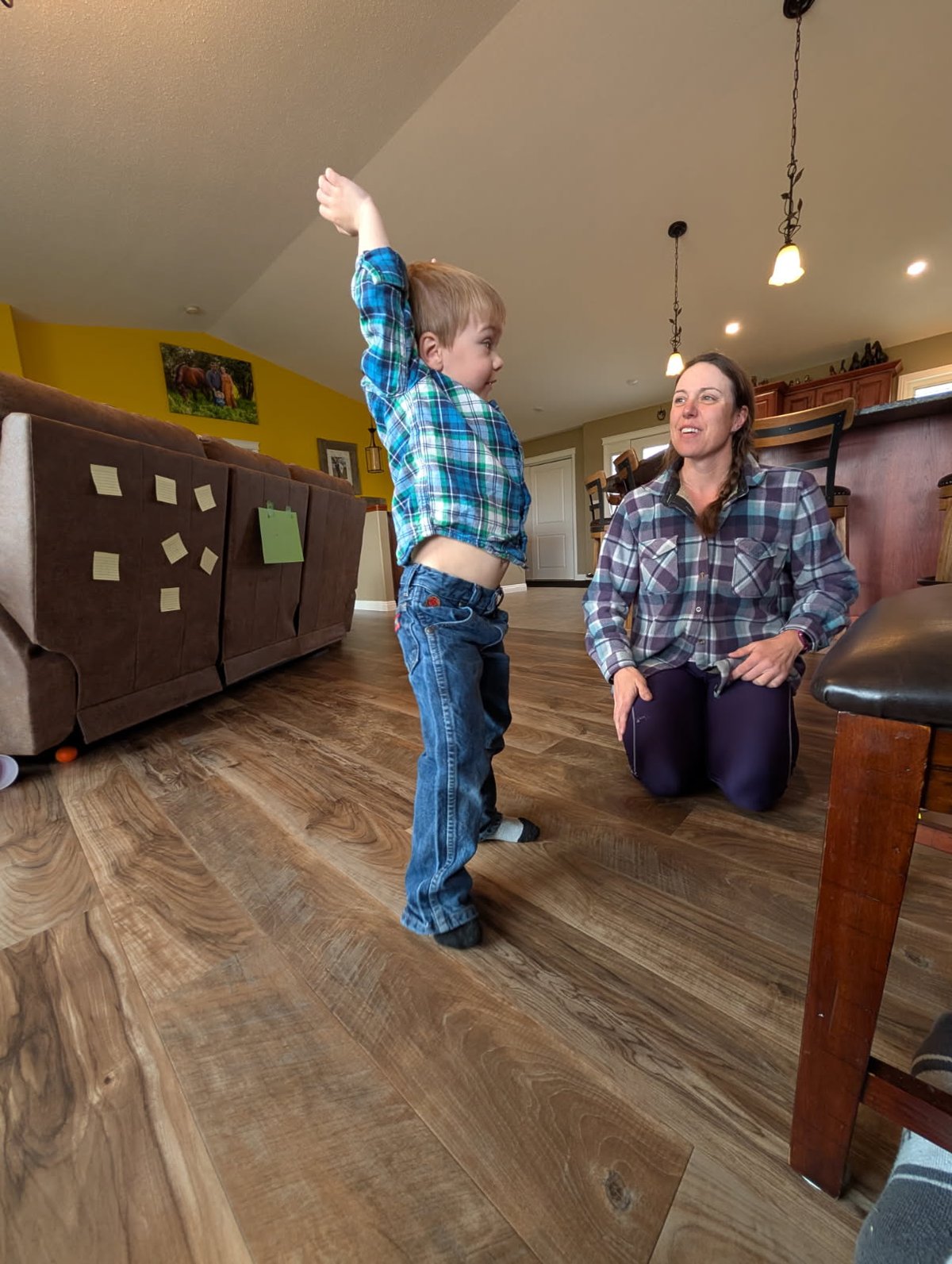 Mom and toddler doing stretching activity from Busy Bees class